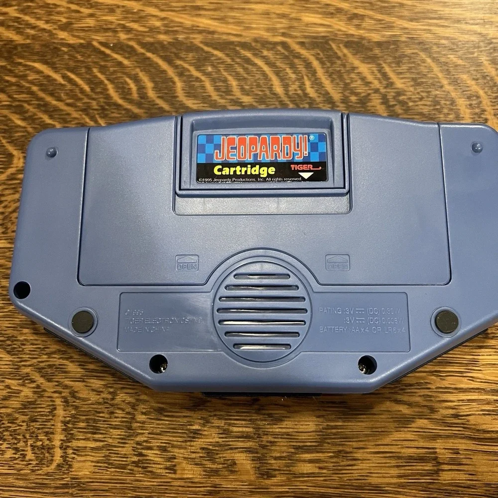 Tiger Electronics Jeopardy Hand Held Game With Cartridge & Answer Question Book